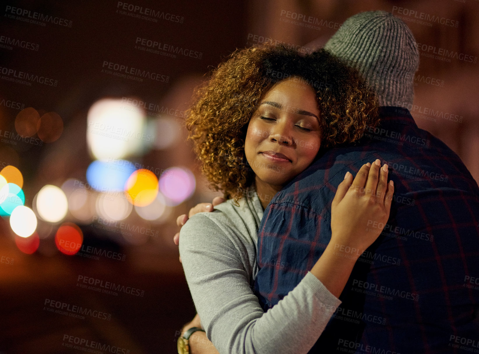 Buy stock photo Cropped shot of a young couple out on a date in the city