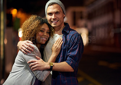 Buy stock photo Cropped shot of a young couple out on a date in the city