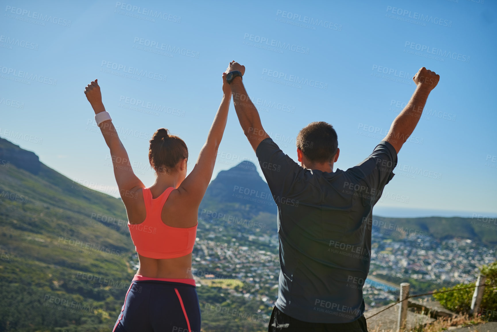 Buy stock photo Happy couple, back view and fitness with fist pump on mountain for winning, victory or achievement in nature. Man, woman or athletes with hands in air for conquer, workout goals or accomplishment