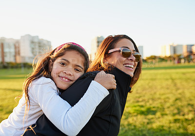 Buy stock photo Portrait of a young girl bonding with her mother at the park