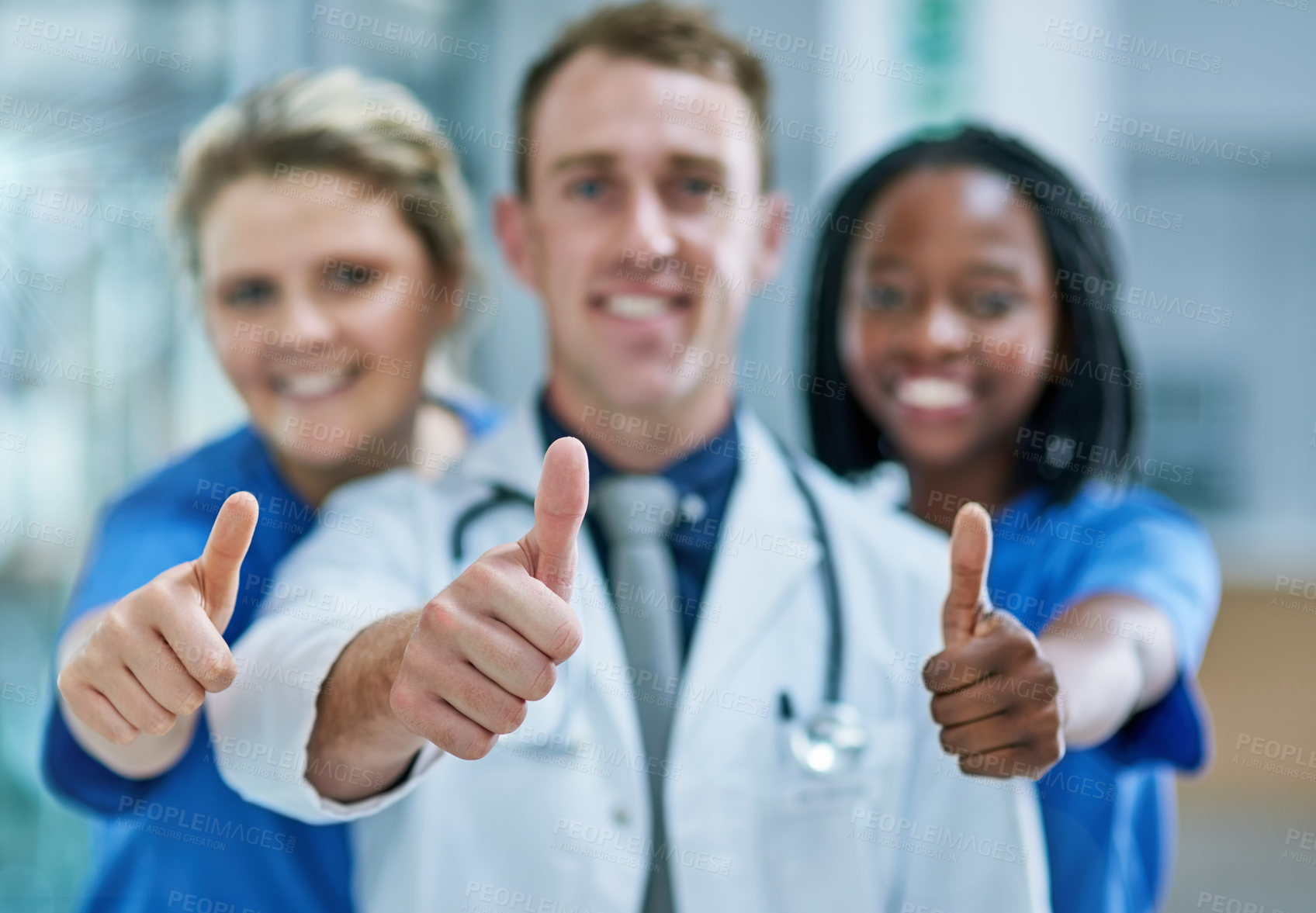 Buy stock photo Portrait of a team of confident young doctors giving thumbs up