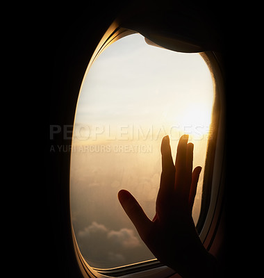 Buy stock photo Shot of an unrecognizable person's hand up against the window of a plane