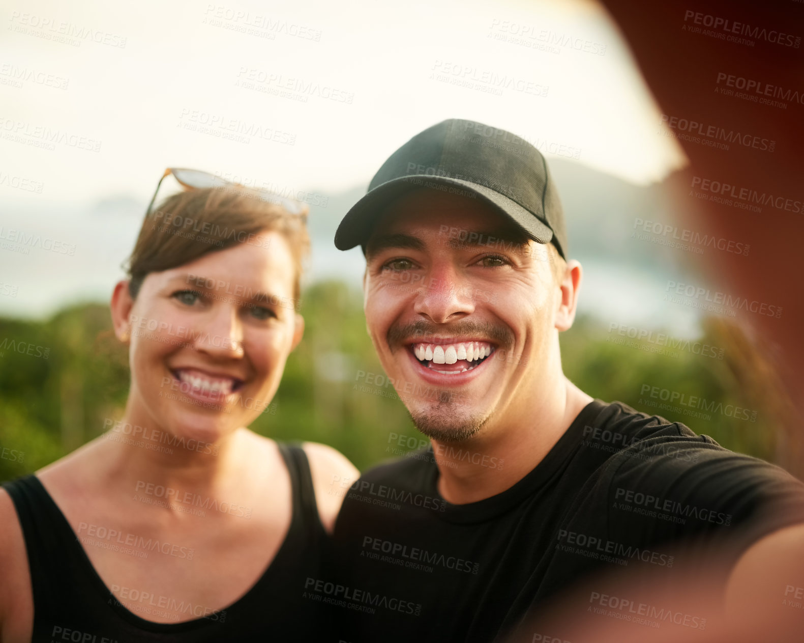 Buy stock photo Portrait of a happy young couple taking a selfie on an island vacation