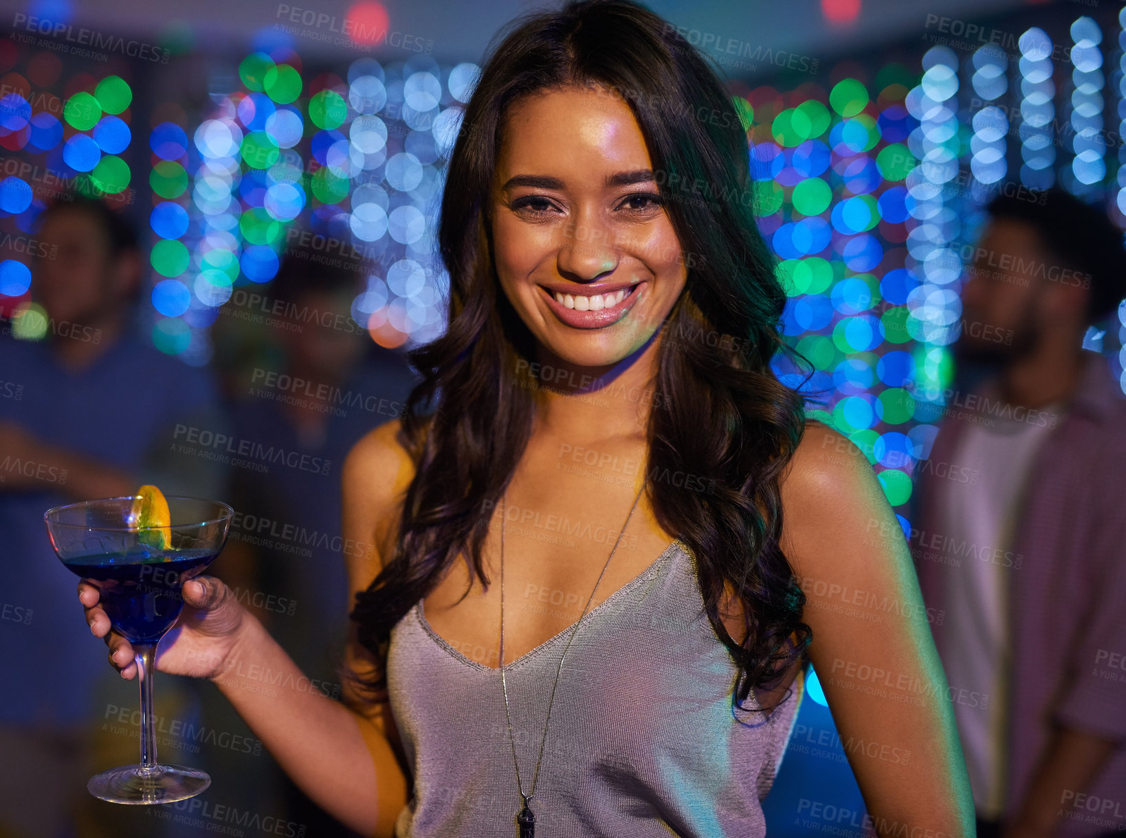 Buy stock photo Portrait of an attractive young woman having a drink while partying in a club