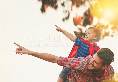 Buy stock photo Shot of a cute little boy and his father playing make believe outside