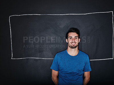 Buy stock photo Studio portrait of a fit young man posing with a chalk illustration of a box against a dark background