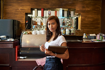 Buy stock photo Portrait of a friendly waitress waiting to serve customers in a Thai restaurant