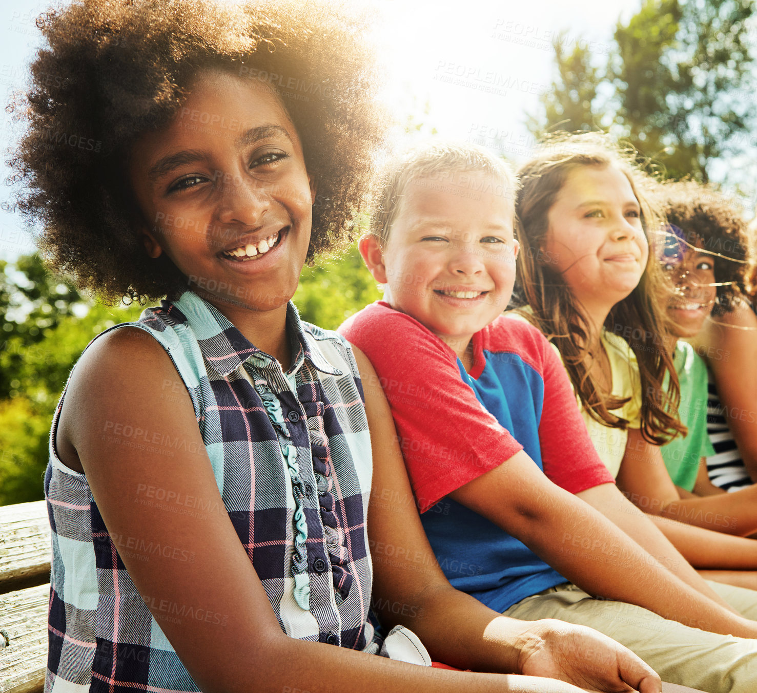 Buy stock photo Portrait of a group of diverse and happy kids hanging out together outside