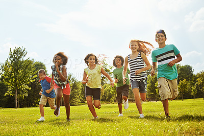 Buy stock photo Happy children, diversity and running with friends in nature for fun, playful day or summer at park. Group of excited kids or youth enjoying sunny outdoor holiday or weekend on grass field together