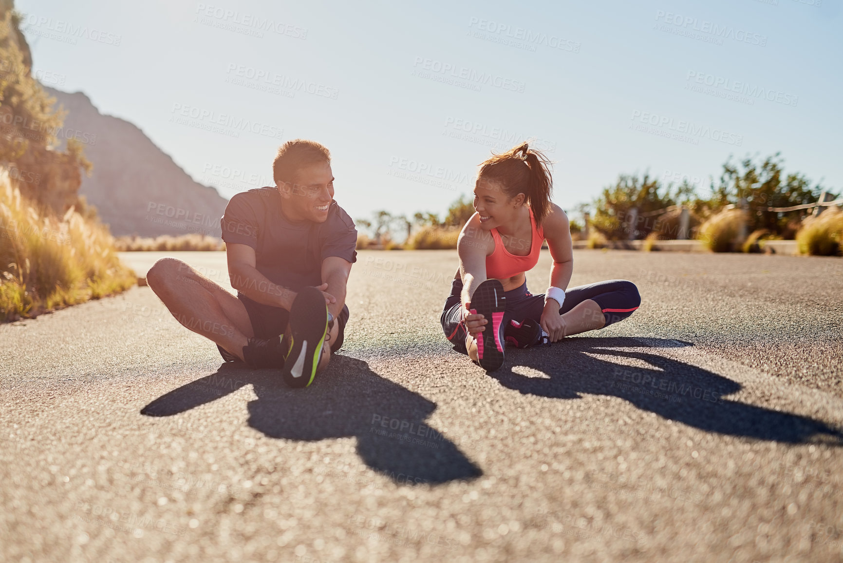 Buy stock photo Warm up, fitness and friends or people in nature for exercise, stretching and marathon training together. Woman, man or sports coach in mountains, trail or wellness workout support or challenge