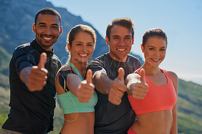 Buy stock photo Cropped shot of a fitness group showing thumbs up