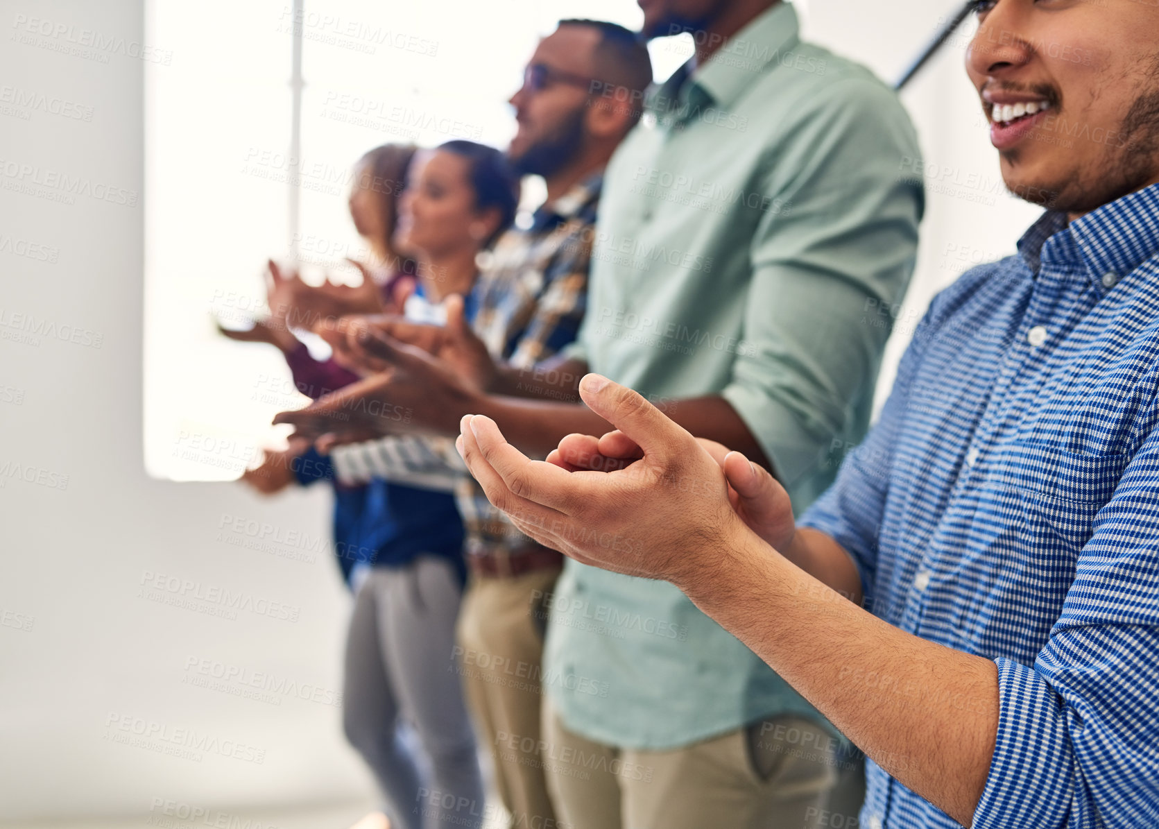 Buy stock photo Cropped shot of a team of designers applauding together in an office