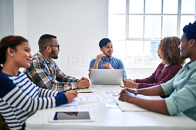 Buy stock photo Cropped shot of a team of designers brainstorming together in an office