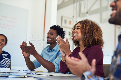 Buy stock photo Cropped shot of a team of designers applauding during a meeting in an office