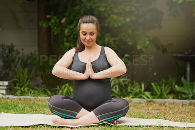 Buy stock photo Full length shot of an attractive young pregnant woman meditating outside