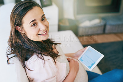 Buy stock photo Cropped portrait of an attractive young pregnant woman working from home