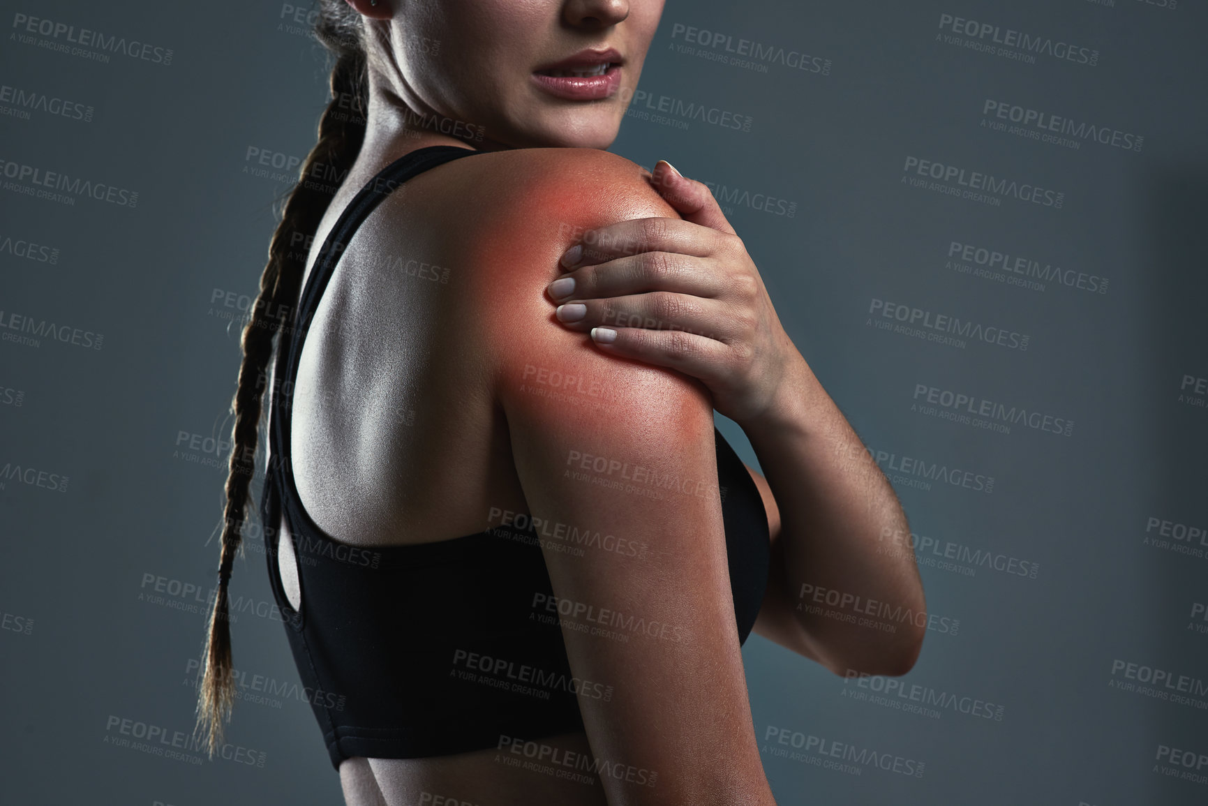 Buy stock photo Fitness, studio or hand of woman with shoulder pain from accident, muscle tension or red glow on dark background. Female athlete, arm injury or massage for relief from arthritis, inflammation or care