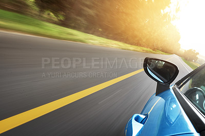 Buy stock photo Shot of a car driving on a road