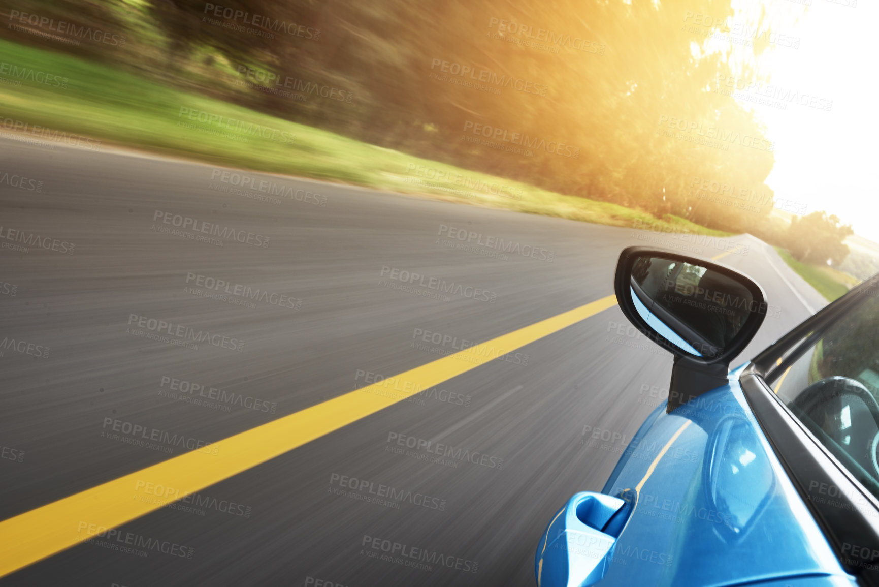 Buy stock photo Shot of a car driving on a road