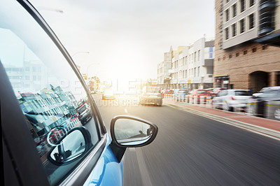 Buy stock photo Shot of a car driving on a road