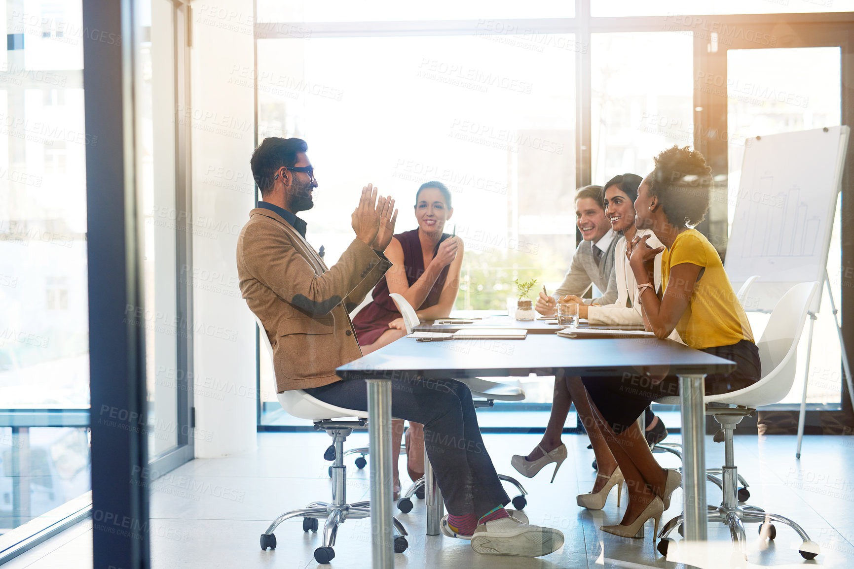 Buy stock photo Shot of a diverse group of businesspeople having a meeting in an office