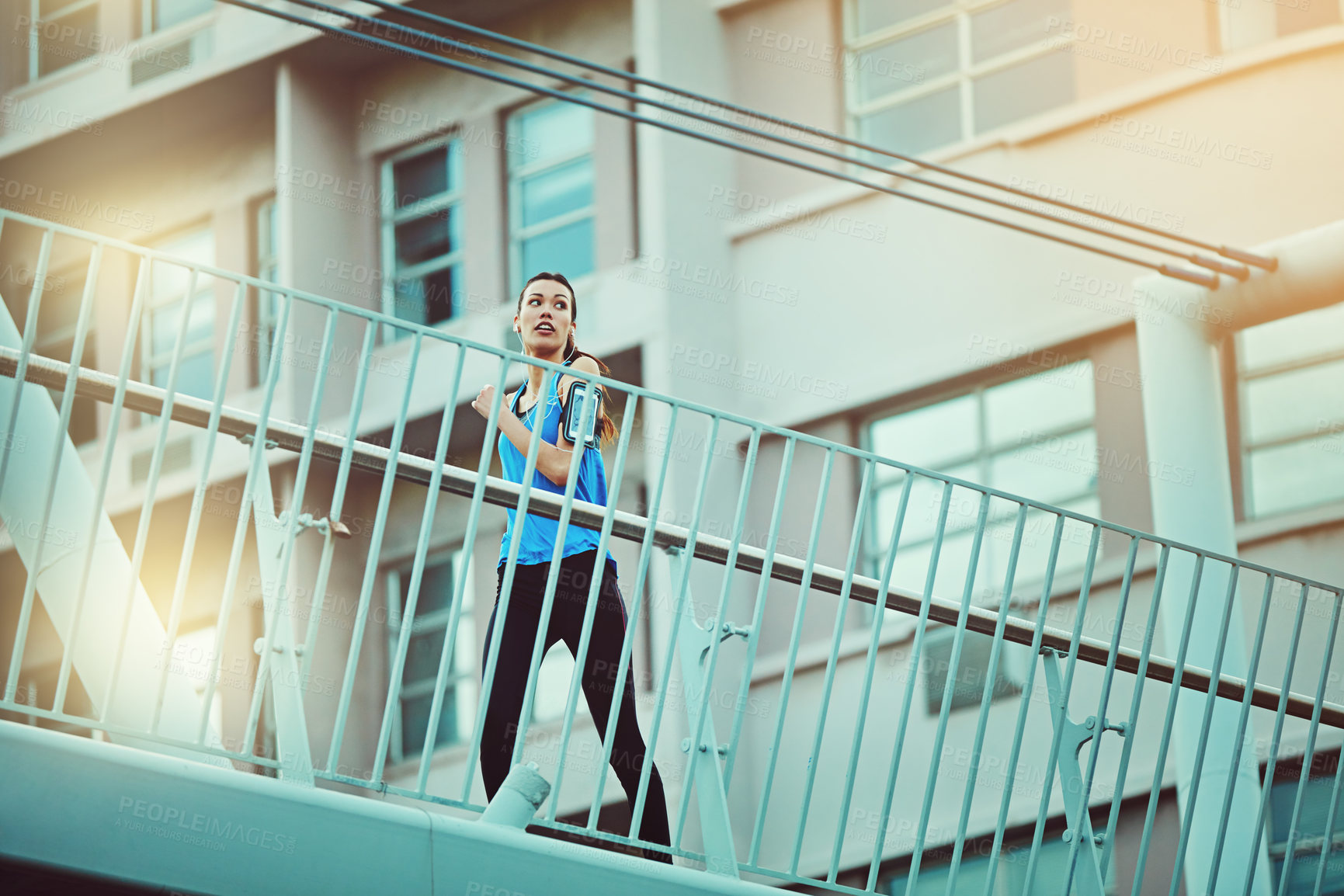 Buy stock photo Shot of young woman working out in the city