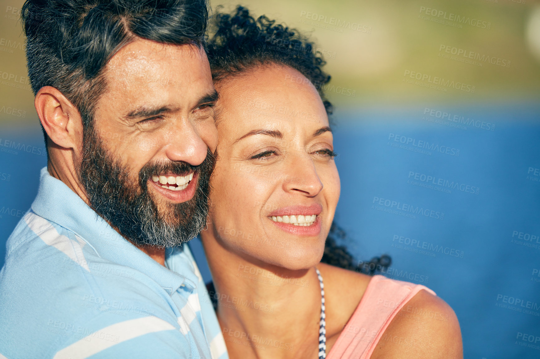 Buy stock photo Shot of a loving couple spending the day at the beach