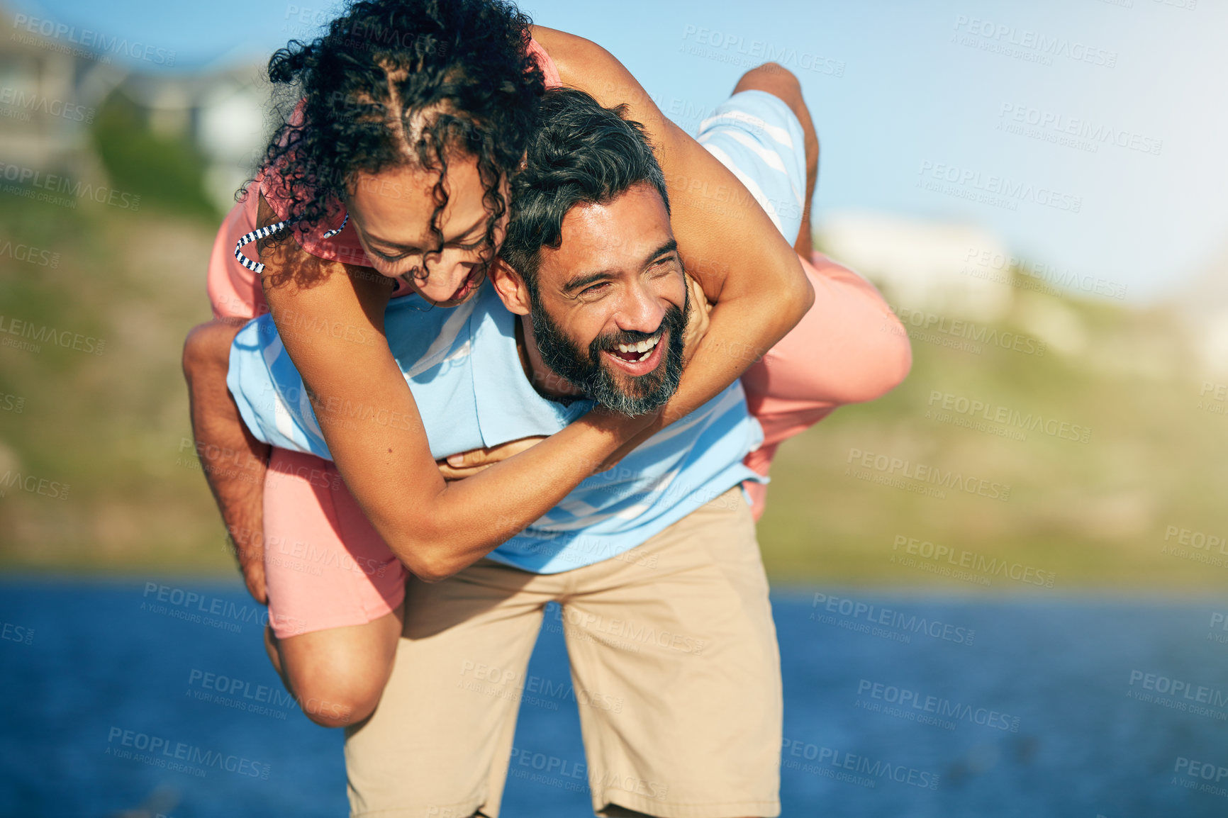 Buy stock photo Shot of a loving couple spending the day at the beach