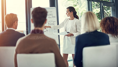 Buy stock photo Cropped shot of a businesswoman giving a presentation to her colleagues in the boardroom