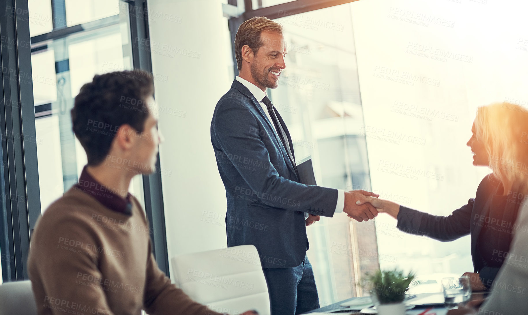 Buy stock photo Office, business people and manager with handshake for greeting, meeting and b2b deal in accounting firm. Flare, employees and accountants with shaking hands for partnership, introduction and welcome