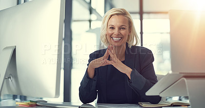Buy stock photo Portrait of a happy businesswoman working at her desk in a modern office