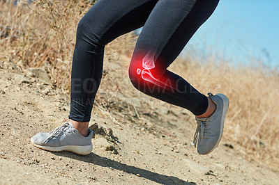 Buy stock photo Shot of an unrecognizable woman running outdoors with a highlighted knee injury