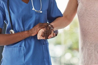 Buy stock photo Closeup shot of a medical practitioner holding a patient's hand in comfort