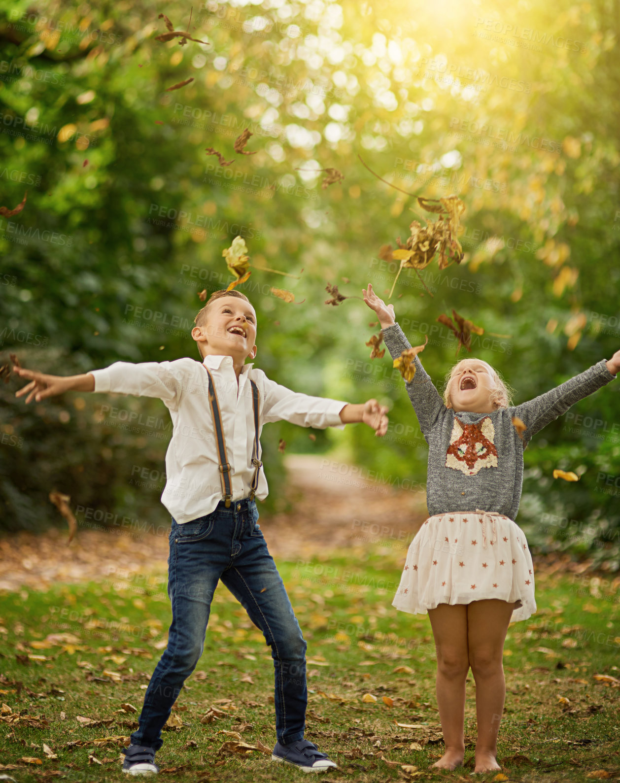 Buy stock photo Girl, boy and children with leaves, fall and playing with smile, excited and bonding on holiday in nature. Kids, siblings and family with plants, trees and happy for games, love and autumn in woods