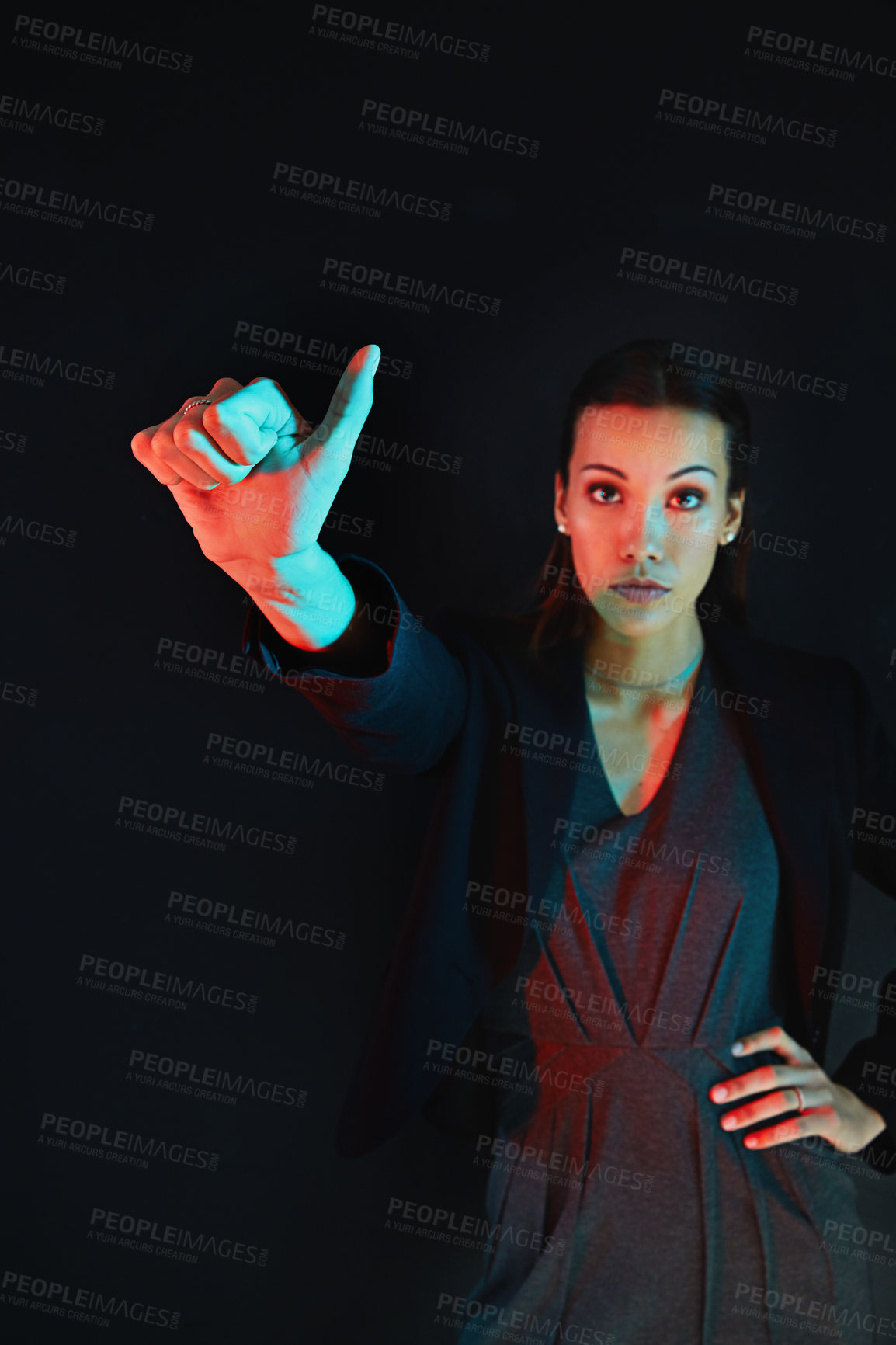 Buy stock photo Portrait of a young businesswoman showing a number with her fingers against a dark background