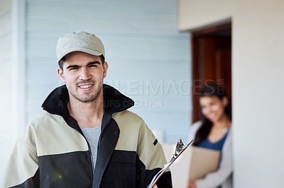 Buy stock photo Portrait of a courier making a home delivery to a customer