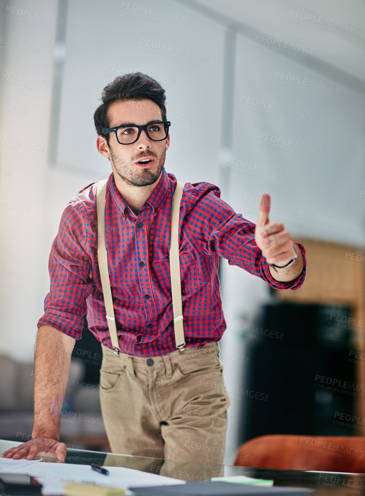 Buy stock photo Cropped shot of a handsome young designer giving thumbs up to a coworker in the office
