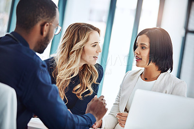 Buy stock photo Cropped shot of three businesspeople working together in the office