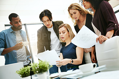 Buy stock photo Talking, planning or meeting group of colleagues brainstorming ideas and discussing strategy with paperwork. Businesswoman explaining documents to diverse creative marketing team in office boardroom