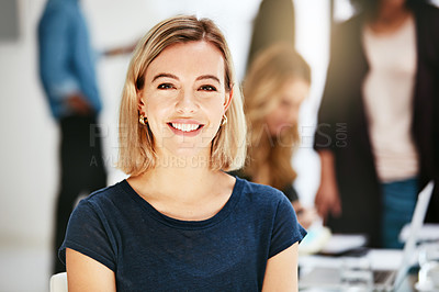 Buy stock photo Happy, smiling and confident business woman sitting in a modern office, workspace or workplace. Portrait of a cheerful, joyful and blonde female corporate professional working at a startup company