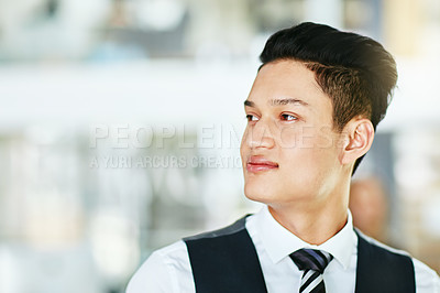 Buy stock photo Young professional waiter, bartender or host looking confident, serious and wearing formal uniform on a blurred background. Closeup side profile, head and face of a man working in hospitality