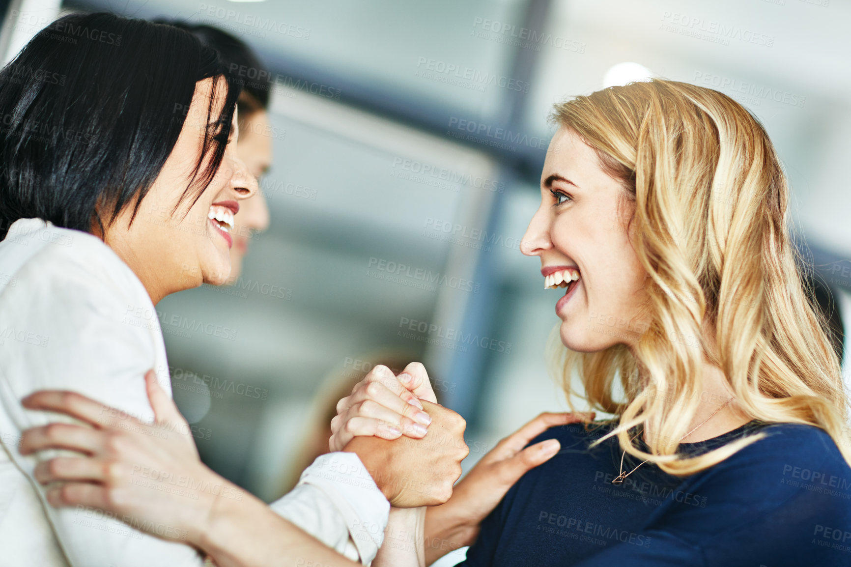 Buy stock photo Business, women and holding hands for solidarity in office with unity, teamwork and happy for partnership. Professional, employees and collaboration with laughing for funny motivation and equality