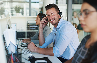 Buy stock photo Portrait of a happy and confident young man working in a call center