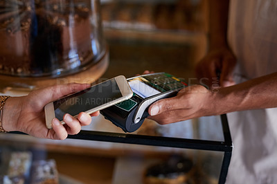 Buy stock photo Closeup shot of a customer paying using NFC technology in cafe