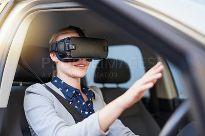 Buy stock photo Cropped shot of a young businesswoman driving while wearing a virtual reality headset