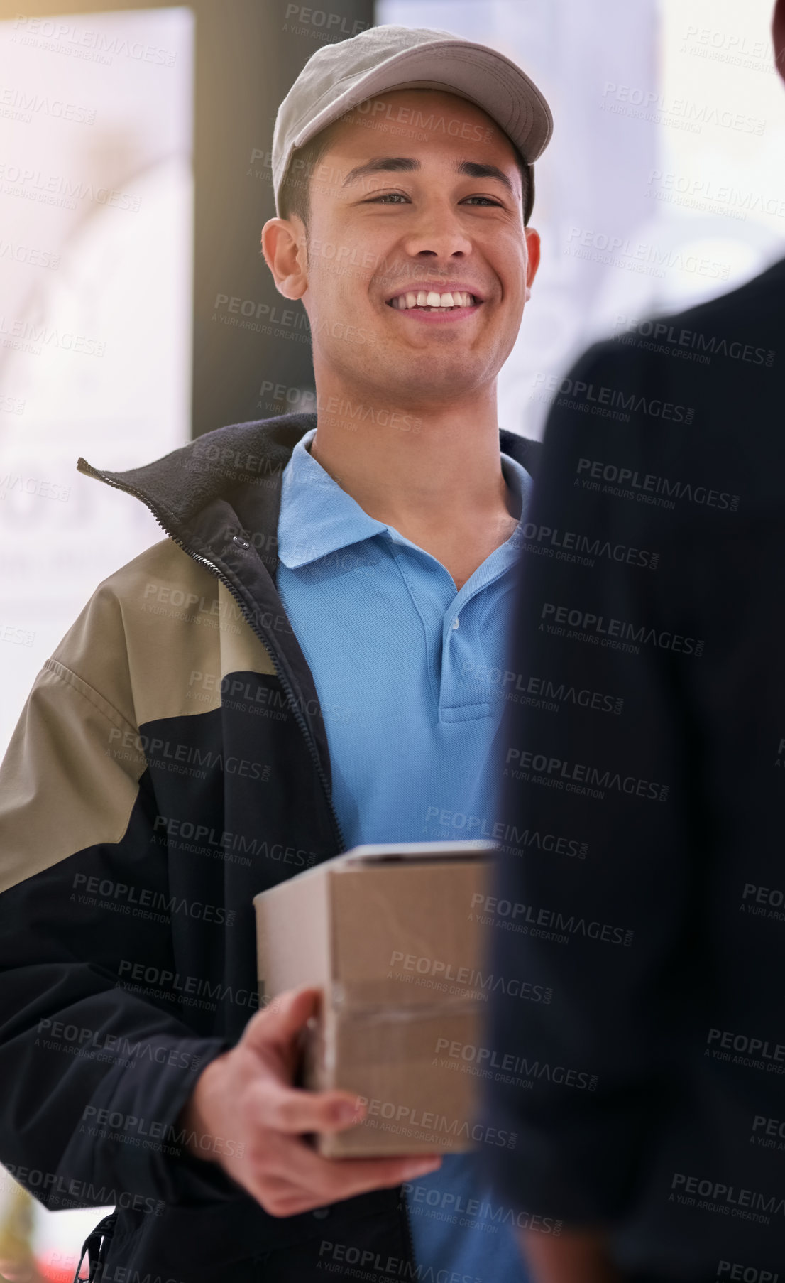 Buy stock photo Shot of a courier making a delivery to an unidentifiable businesswoman in her office