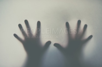 Buy stock photo Defocussed shot of a pair of hands reaching out against a plain background