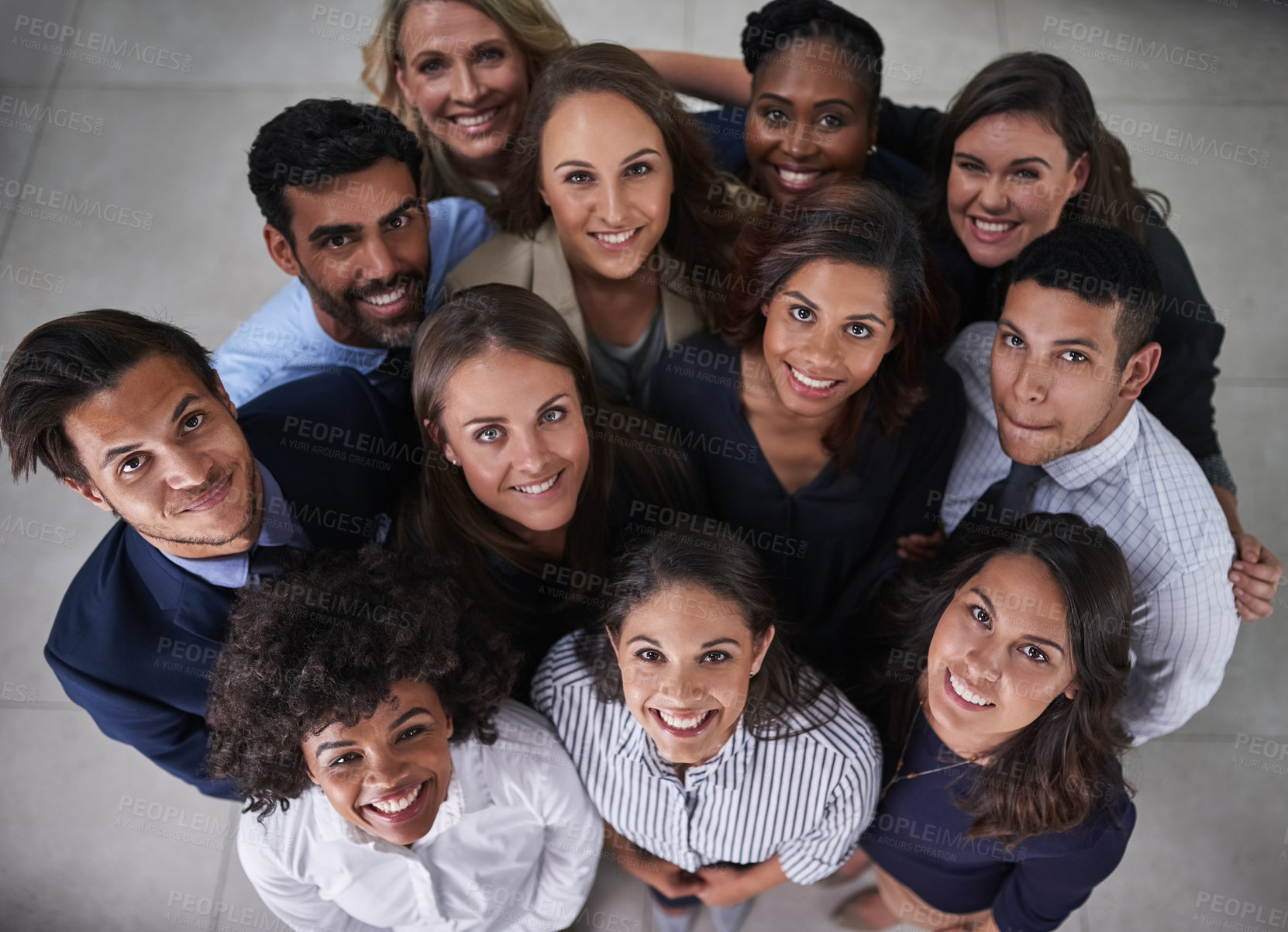 Buy stock photo Collaboration, huddle and smile with portrait of business people in office together from above. Face, teamwork or unity with happy professional men and women in circle at workplace for solidarity