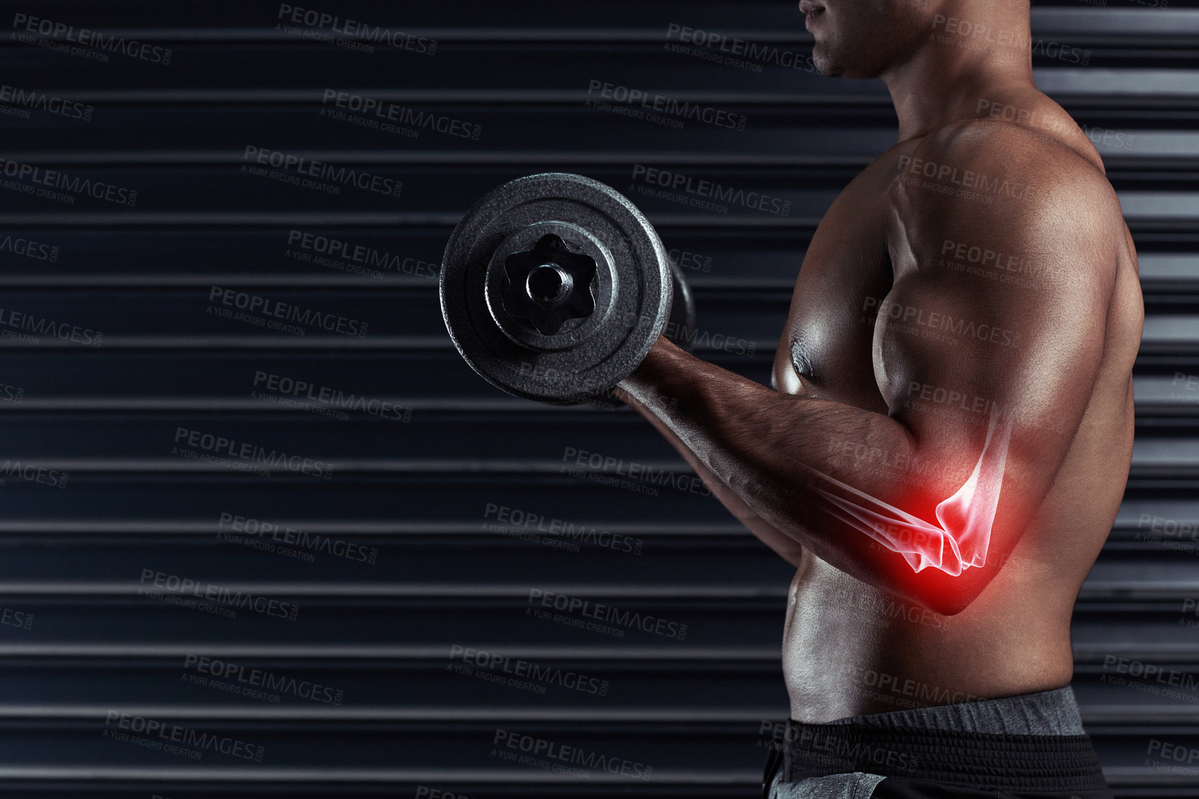 Buy stock photo Cropped shot of an unrecognizable young man working out with a dumbbell