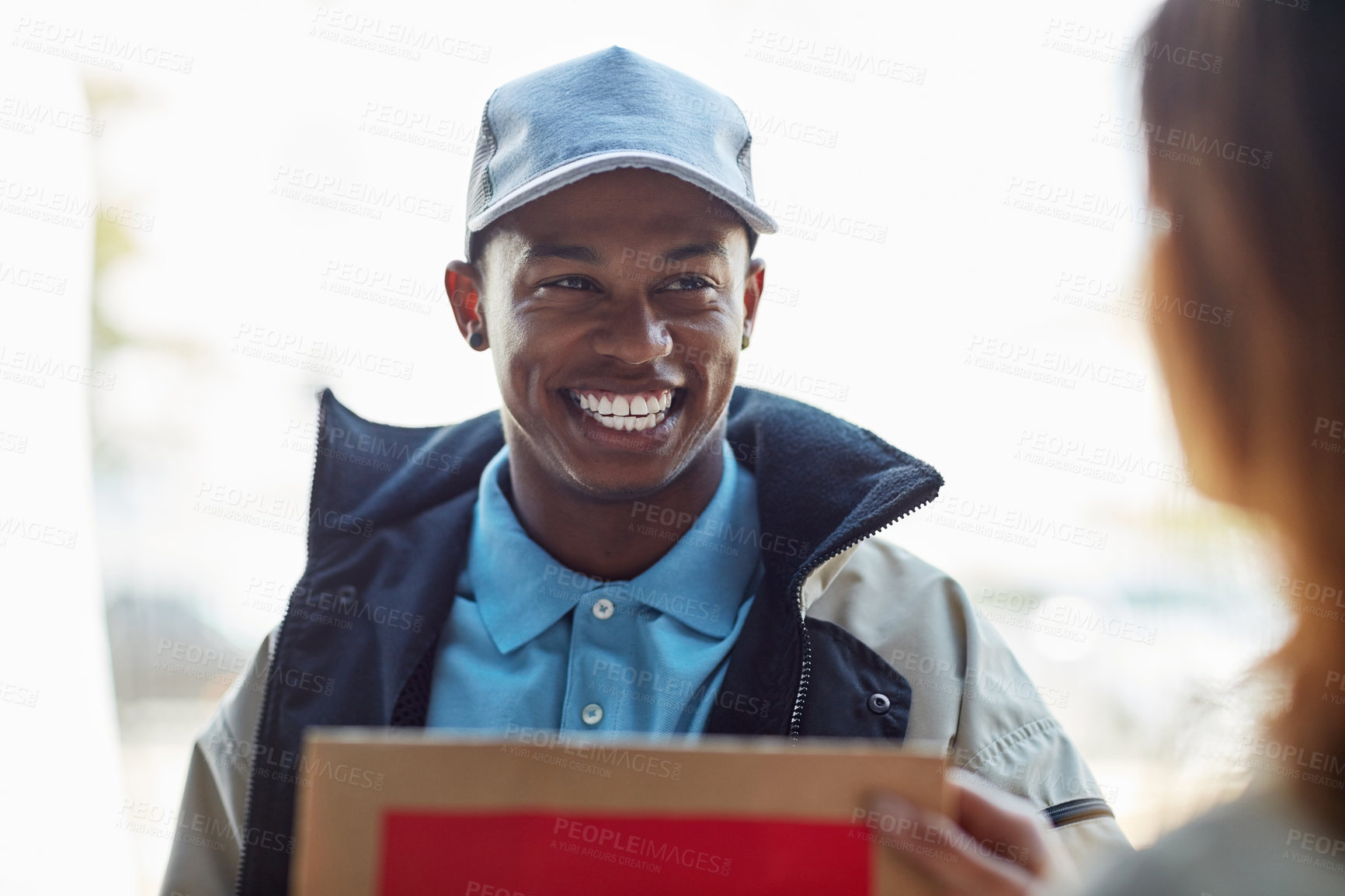 Buy stock photo Cropped shot of a courier making a delivery to a customer